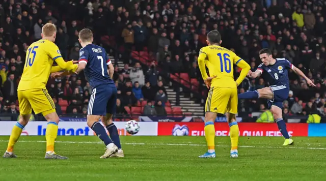 John McGinn drills in the free-kick to level at Hampden