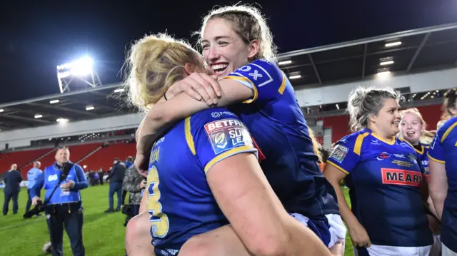 Caitlin Beevers celebrates after Leeds Rhinos win the Super League Grand Final