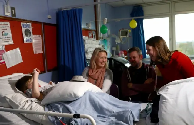 Jo Swinson greets a child as she visits University Hospital in Southampton, Britain November 19, 2019