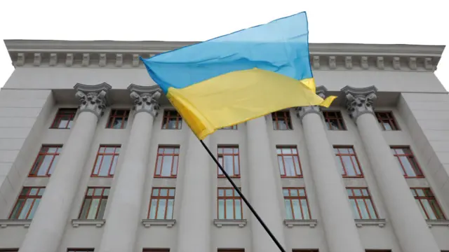 A Ukrainian flag flies outside the Office of the President in Kyiv