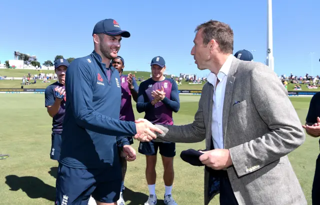 Dom Sibley is presented with his cap by Michael Atherton