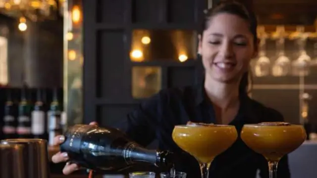 Woman pouring drink