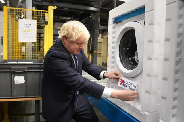 Boris Johnson with a washing machine