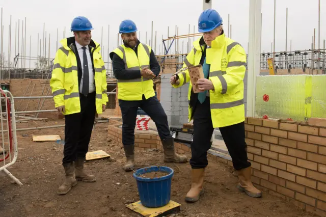 Prime Minister Boris Johnson (right) during a visit to David Wilson Homes in Bedford