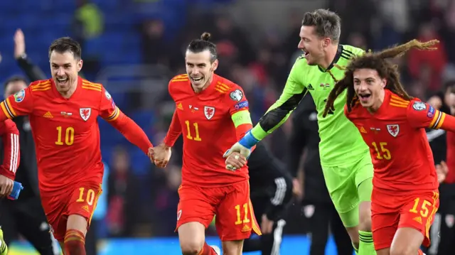 Gareth Bale celebrates with his Wales team-mates