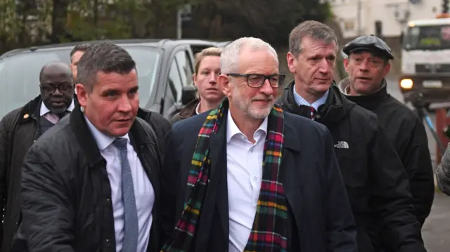 Jeremy Corbyn being escorted into a Dudley Pensioners' club by police