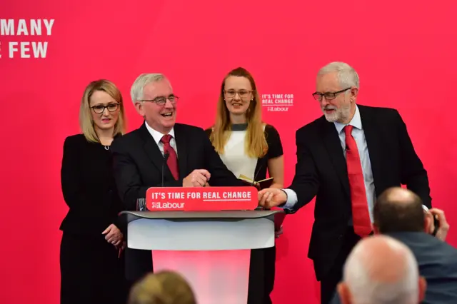 hadow Secretary of State for BEIS Rebecca Long-Bailey, Shadow Chancellor John McDonnell and Labour leader Jeremy Corbyn address the audience at the University of Lancaster