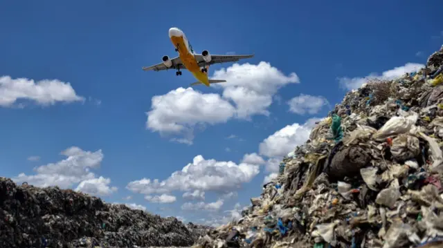 A plane on a descent through a garbage landfill on April 16, 2018 in Manila, Philippines