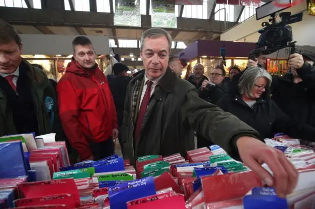 Brexit Party leader Nigel Farage looks for a card for his mother in the Market Hall at Middleton Grange Shopping Centre whilst on the General Election campaign trail in Hartlepool, County Durham. PA Photo. PA Photo. Picture date: Saturday November 23, 2019