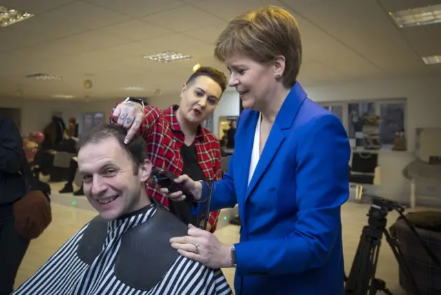 SNP leader Nicola Sturgeon gives her party's candidate for North East Fife Stephen Gethins