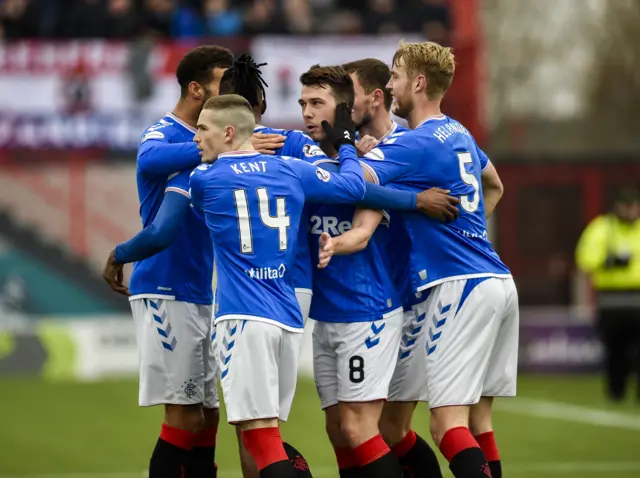 Ryan Jack is congratulated by his team-mates after firing Rangers in front