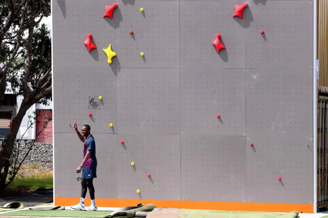 Jofra Archer looks up at a climbing wall during a practice session at Bay Oval in Mount Maunganui