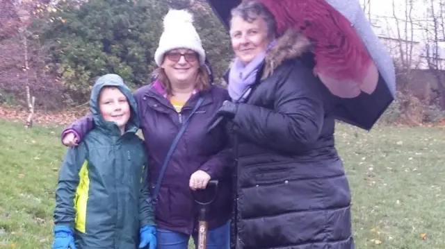 Zac Dickenson and his grandmother Sue after planting tree