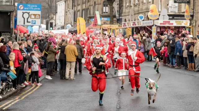 Photos of Santas running