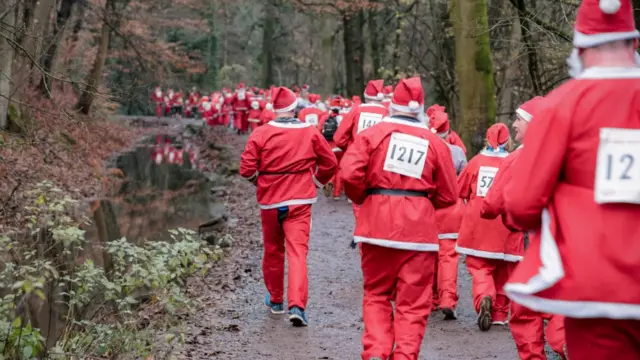 Photos of Santas running