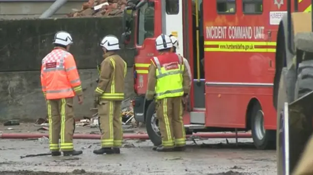 Firefighters at waste recycling fire