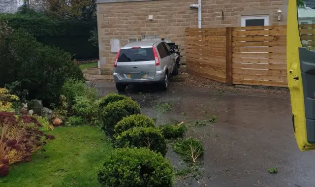 Car through house wall