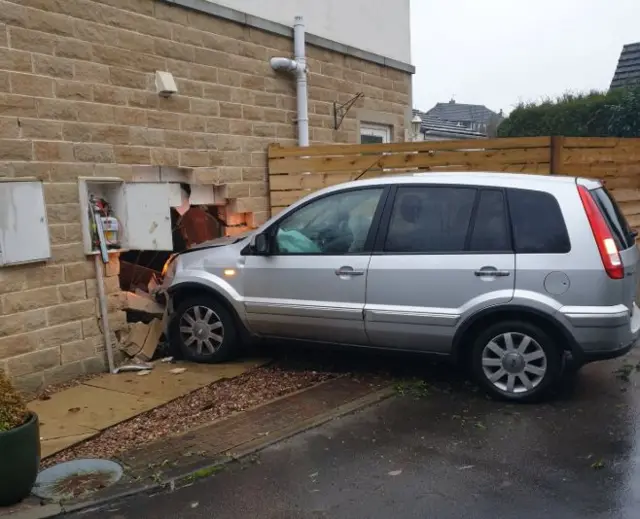 Car through house wall