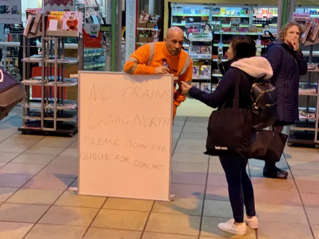 Passenger seeks information at Preston station