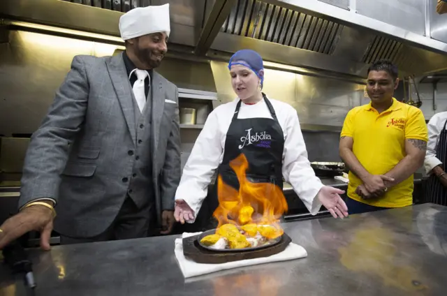 Liberal Democrat leader Jo Swinson helps make a chicken tikka masala during a visit to the Ashoka restaurant in Bearsden, Glasgow, during the General Election campaign. P