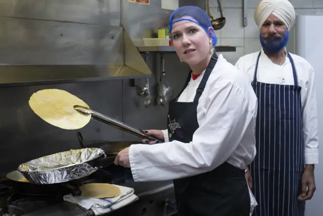 Liberal Democrat leader Jo Swinson helps make poppadoms during a visit to the Ashoka restaurant in Bearsden, Glasgow, during the General Election campaign