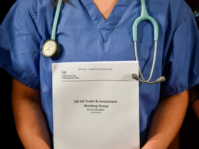 An NHS worker with a dossier