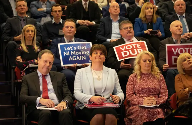 Northern Ireland"s Democratic Unionist Party (DUP) leader Arlene Foster (front 2L) and deputy leader Nigel Dodds (front L) attend an event to present the party"s general election manifesto in Belfast on November 28, 2019.