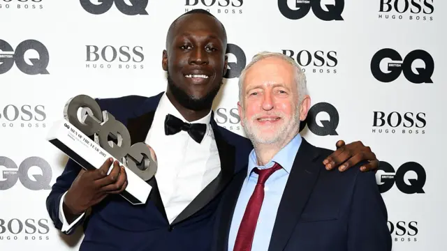 Stormzy posing with the Labour leader in at an awards ceremony in 2017