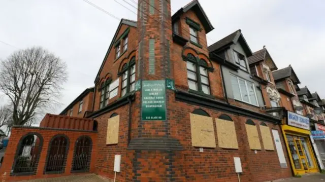 Windows boarded up at mosque