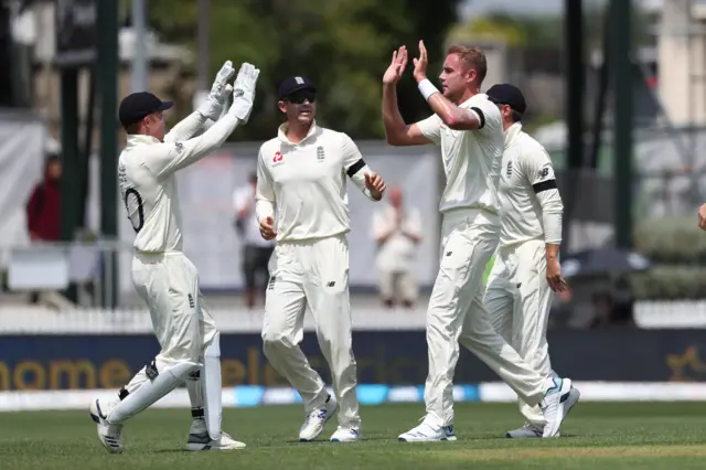 Stuart Broad (R) celebrates the wicket of New Zealand's Jeet Raval