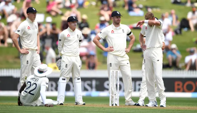 England react after Stuart Broad"s dismissal of Ross Taylor is overturned by the 3rd umpire during day 1 of the second Test match between New Zealand and England at Seddon Park