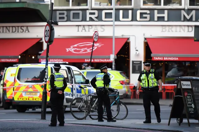 A police office enforces a cordon