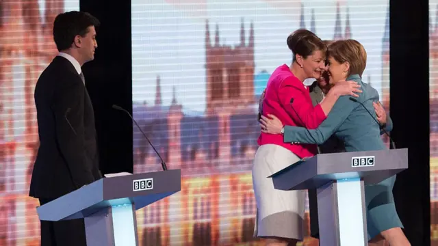 Ed Miliband watches as Leanne Wood, Natalie Bennett and Nicola Sturgeon share a hug after a 2015 BBC election debate