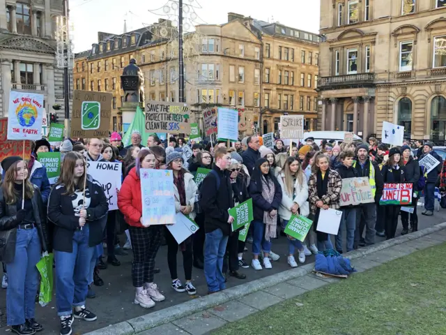 People listen to Scottish Greens co-leader Patrick Harvie speak at a climate strike in Glasgow"s George Square. PA Photo. Picture date: Friday November 29, 2019. Harvie has said any word that comes out of Boris Johnson"s mouth cannot be trusted, after the Prime Minister avoided a leader"s debate on climate. See PA story POLITICS Election ScotGreens.