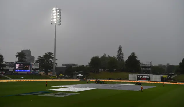 The field is covered as rain stops play during day 1 of the second Test match between New Zealand and England at Seddon Park