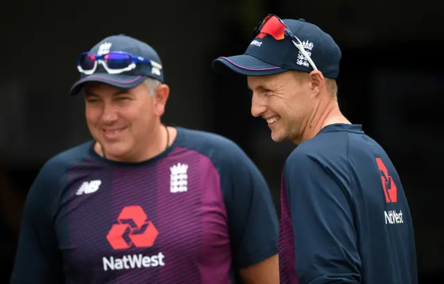 England captain Joe Root speaks with coach Chris Silverwood during a nets session at Seddon Park