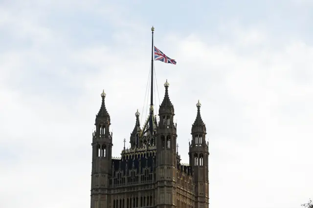 The Union Jack flying at half mast over Victoria Tower at the Houses of Parliament.