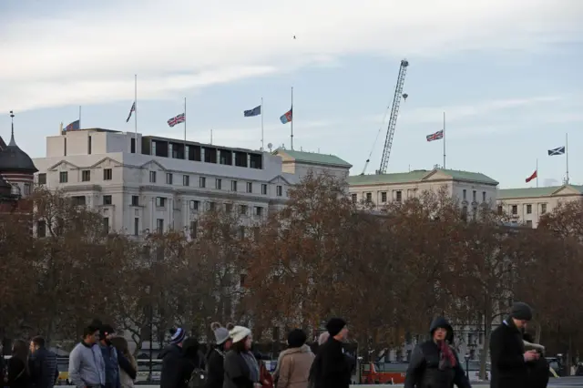 Flags fly at half mast on government buildings in tribute to victims