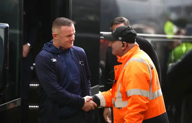 Wayne Rooney greeted by security on his arrival at Pride Park