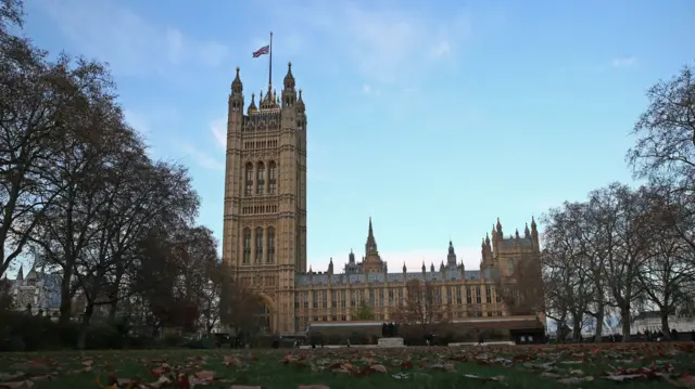 The Union Jack flying at half mast over Victoria Tower at the Houses of Parliament.