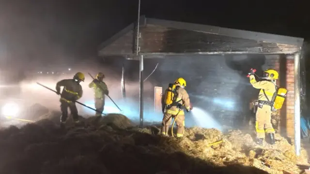 Firefighters fighting fire