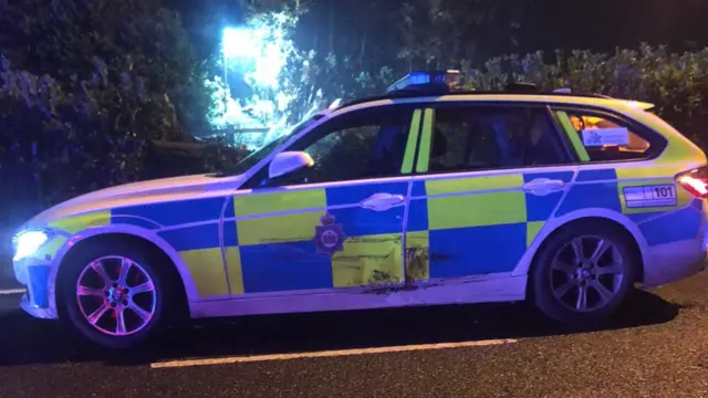 A damaged police car