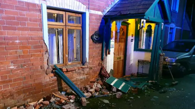 Porch and house damaged after crash