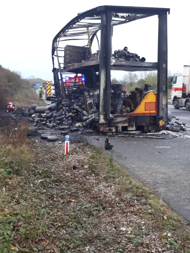 Burnt-out lorry on motorway