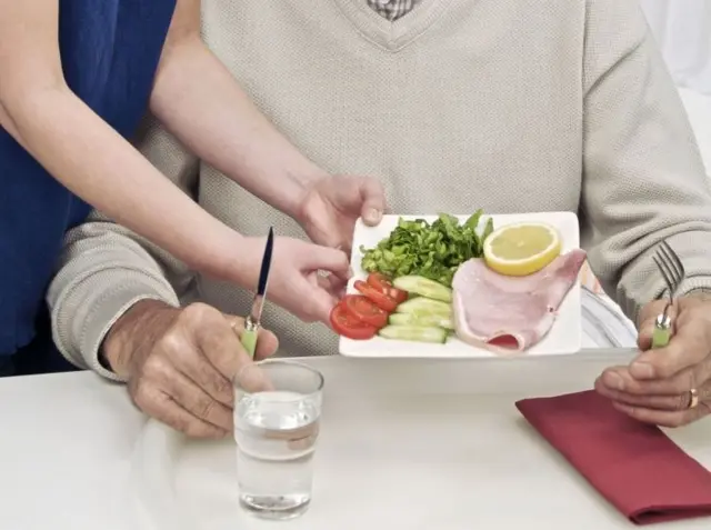 Man being given meal