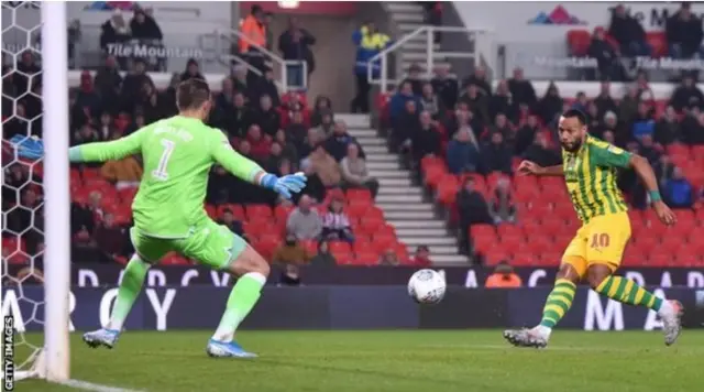 West Brom's Matt Phillips kicking ball towards goal