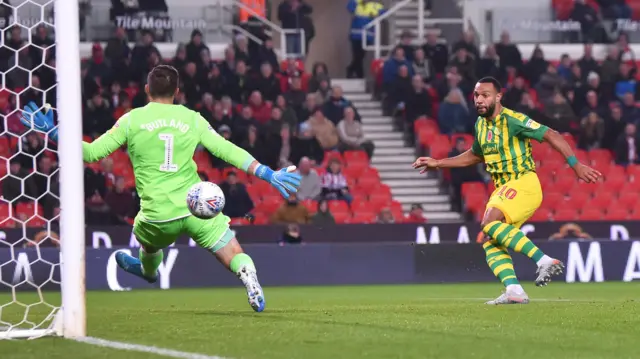 Matt Phillips of West Bromwich scores the first goal against Stoke