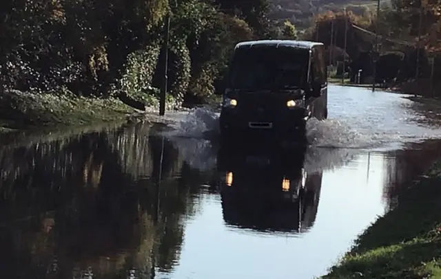 Van going through flood water