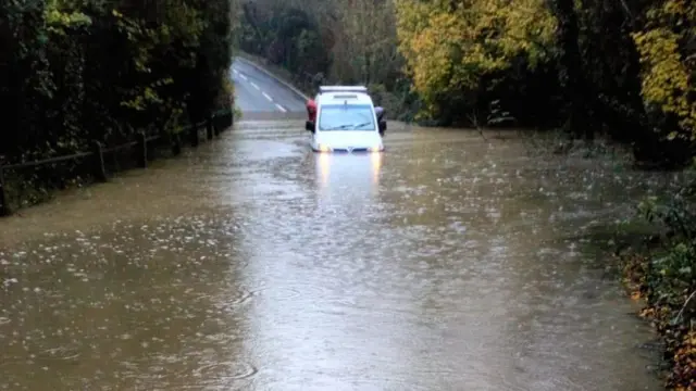 Car in floodwater in Killamarsh