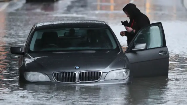 A man with his car trapped